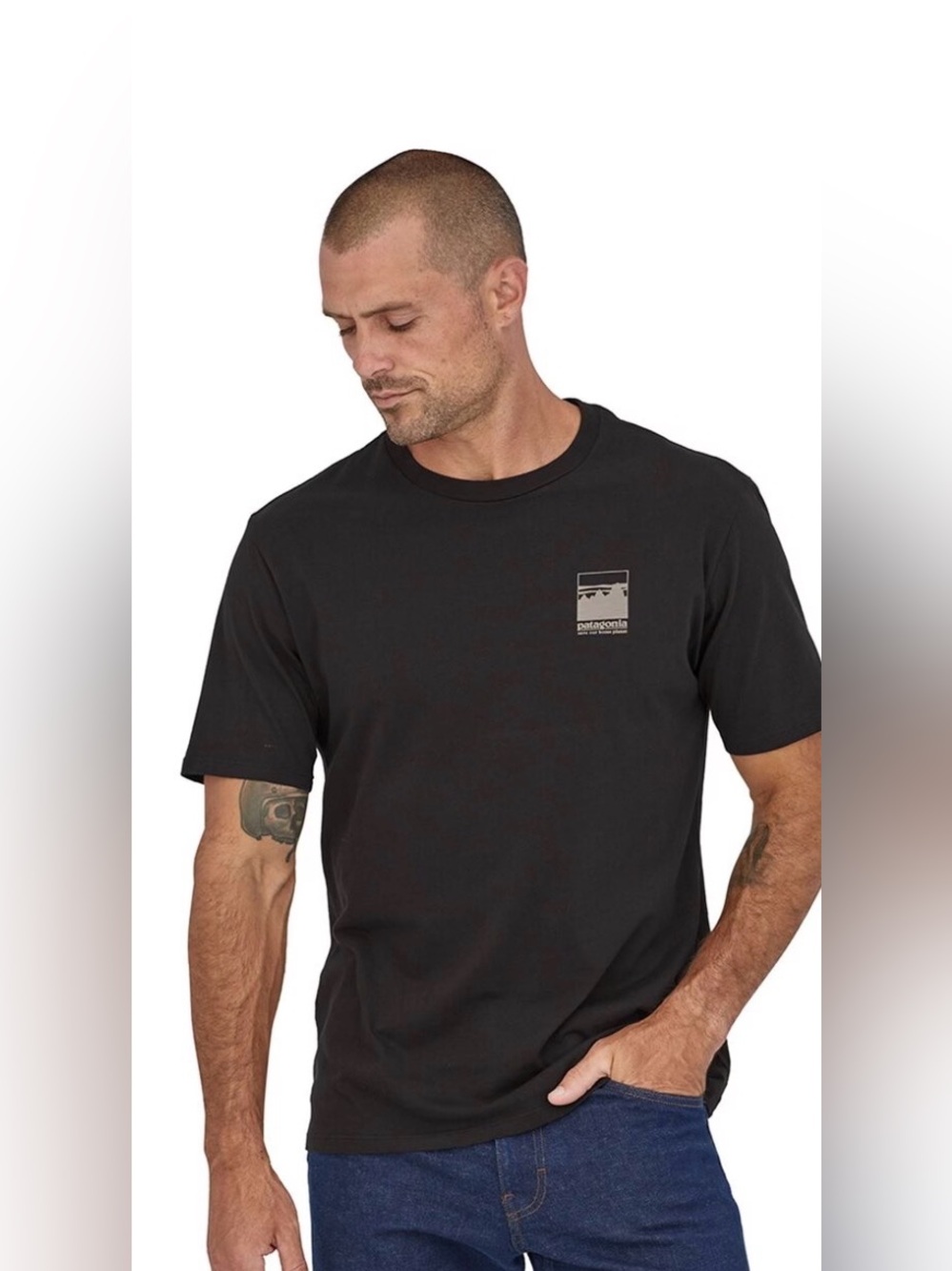 Patagonia Black Short-Sleeve Tee with Chest Graphic has a few pin holes see pics